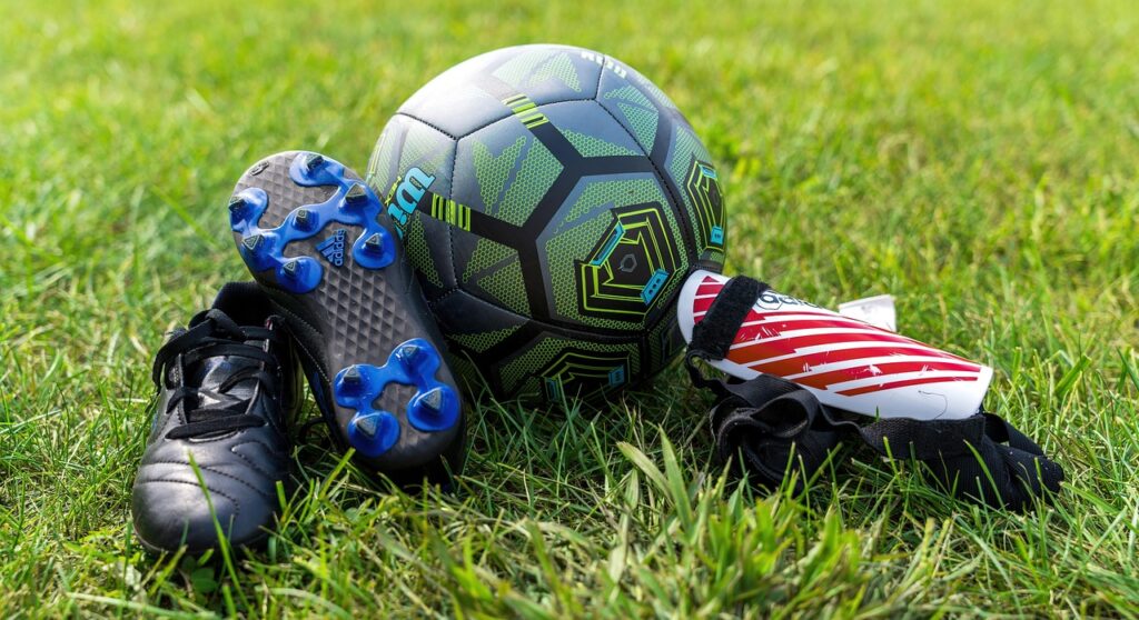 soccer, gear, ball, soccer shoes, soccer ball, soccer gear, sport, equipment, nature, cleats, shin guards, protection, sports, grass, hobby, recreational activity